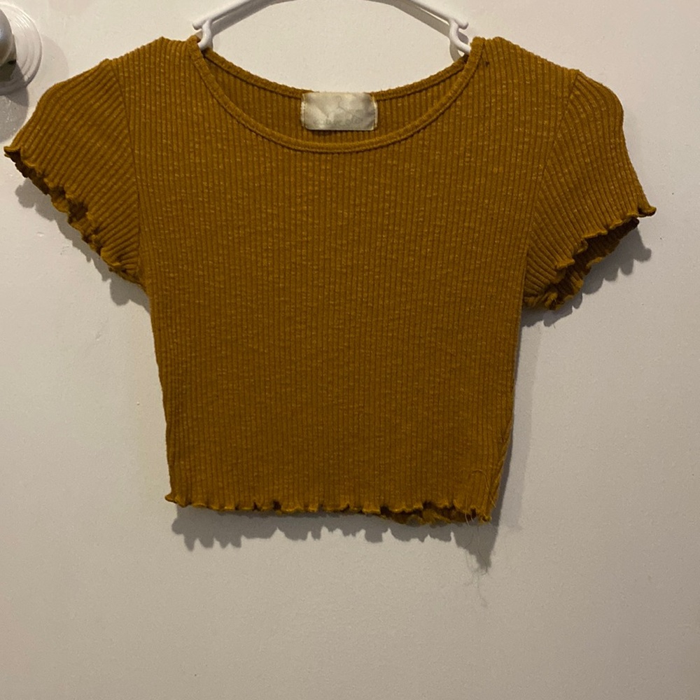 A golden brown cropped top